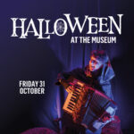 A person in a dark costume plays an accordion, with Halloween-themed text promoting an event at the museum on October 31st.