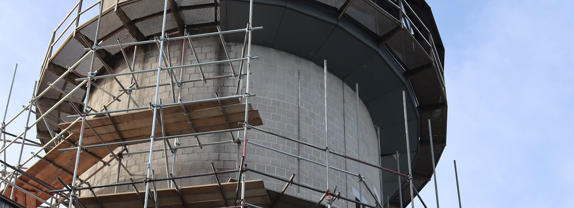 A photograph of a Tower covered in scaffolding