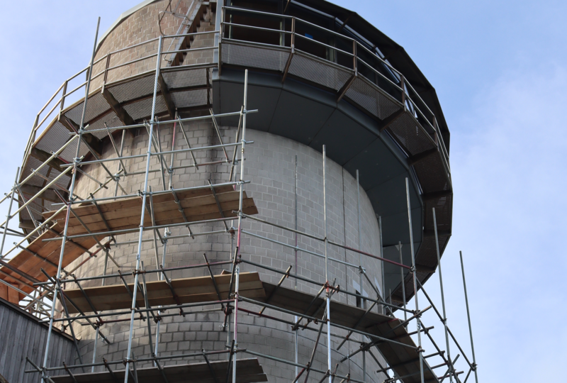 A photograph of a Tower covered in scaffolding