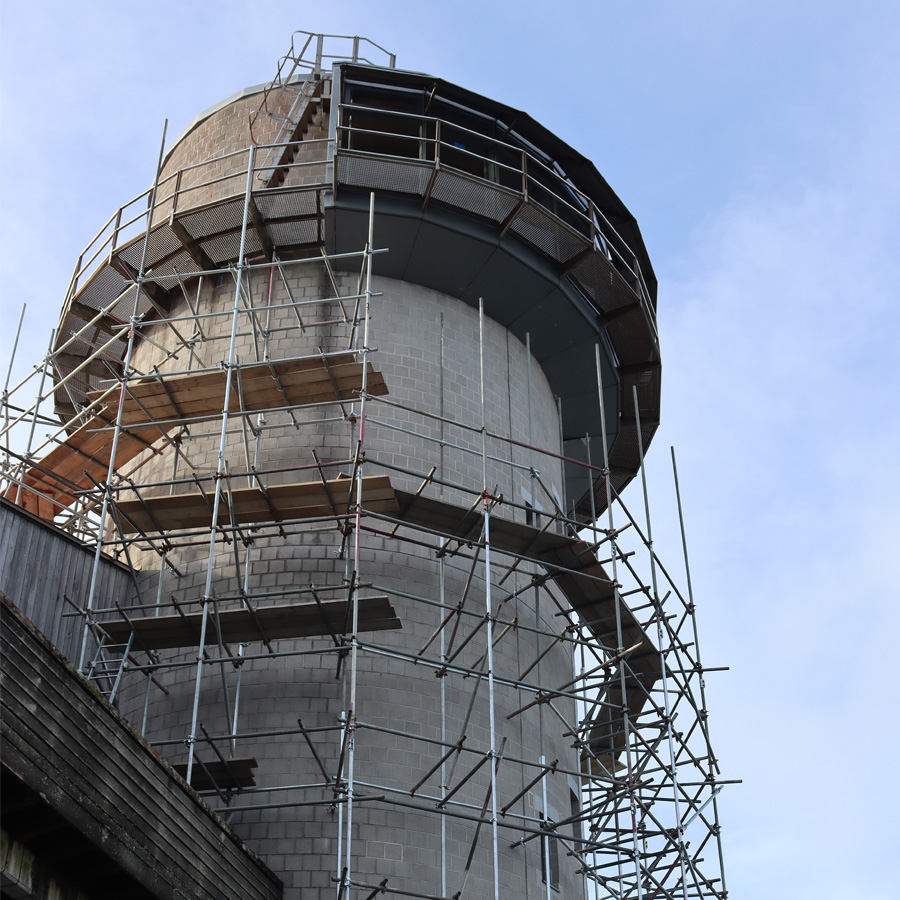 A photograph of a Tower covered in scaffolding