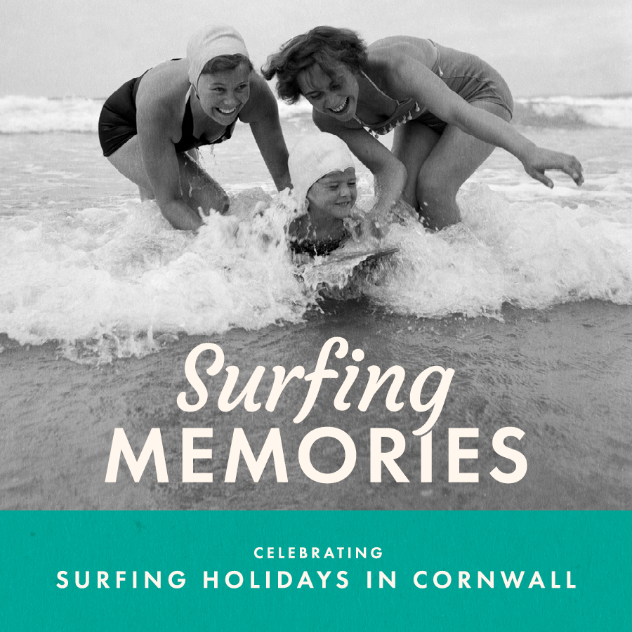 Two women and one child, in vintage swimsuits laugh and play in the surf at the beach; text reads "Surfing Memories, Celebrating Surfing Holidays in Cornwall."