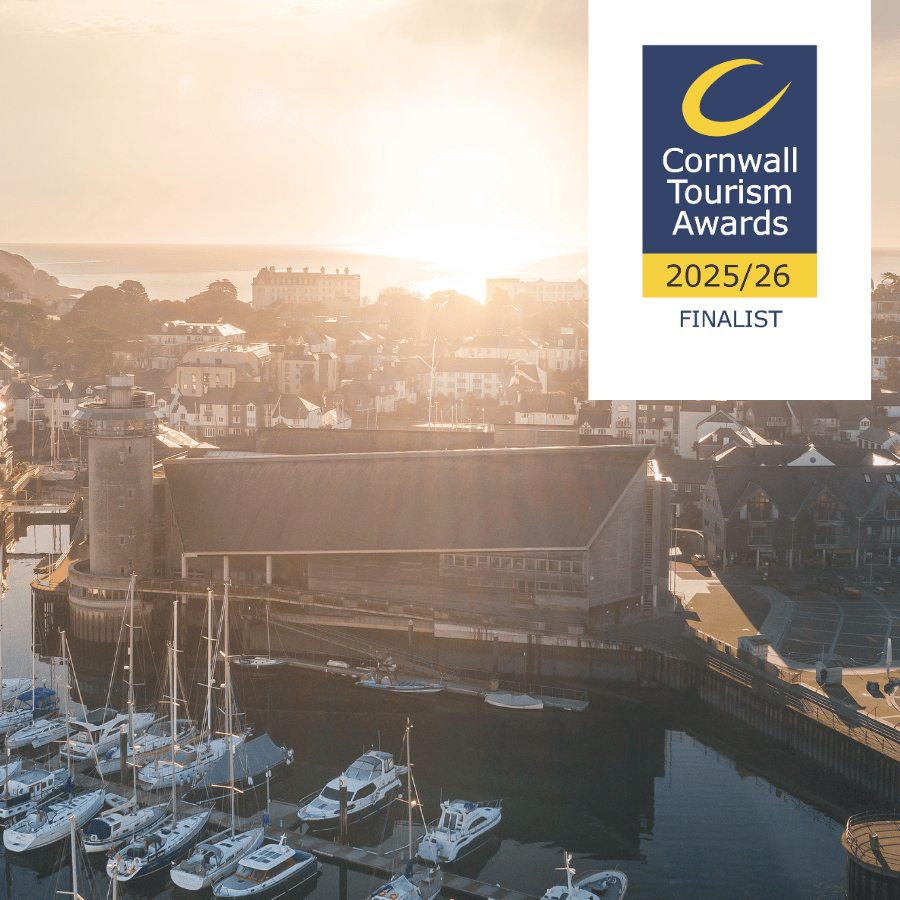 An aerial photograph of National Maritime Museum Cornwall with a graphic logo that reads Cornwall Tourism Awards 2025/26 Finalist.