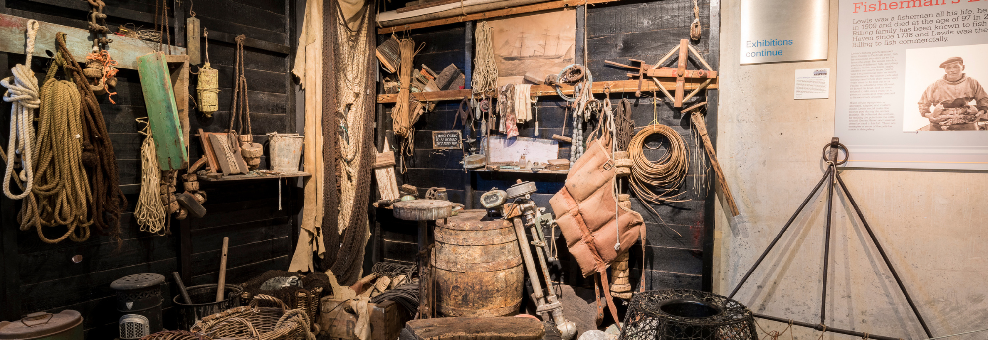 The Cornish Quayside Gallery at National Maritime Museum Cornwall, with authentic display of fishing equipment and objects.
