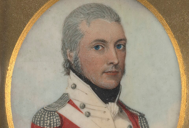 Portrait of a man with smart grey hair, wearing a military coat covered in buttons, with shoulder epaulettes.