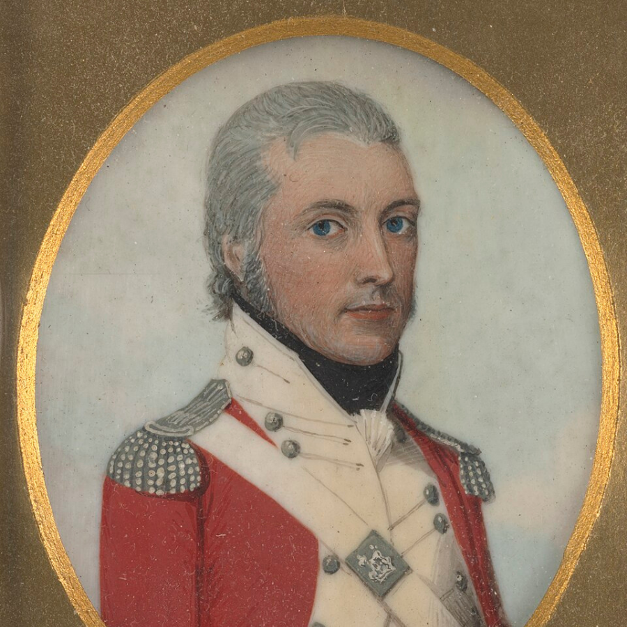 Portrait of a man with smart grey hair, wearing a military coat covered in buttons, with shoulder epaulettes.